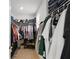 Walk-in closet with organized shelves and hanging space for clothes, shoes, and accessories at 5226 Mahogany Dr, Mount Dora, FL 32757