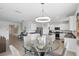 Open-concept design featuring kitchen, and dining area with a stylish chandelier at 5226 Mahogany Dr, Mount Dora, FL 32757