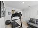 Bright exercise room with treadmill, comfortable couch, and sports memorabilia at 5226 Mahogany Dr, Mount Dora, FL 32757