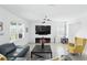 A cozy living room with neutral colors, bright light, and comfortable seating arrangement at 5226 Mahogany Dr, Mount Dora, FL 32757