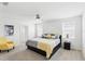 A bright main bedroom featuring a ceiling fan, two windows, and neutral décor at 5226 Mahogany Dr, Mount Dora, FL 32757