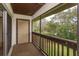 Enclosed balcony features wood railing, and a storage closet at the back at 600 Northern Way # 404, Winter Springs, FL 32708