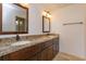 Bathroom features a granite countertop, dual sinks, and vanity lighting at 600 Northern Way # 404, Winter Springs, FL 32708