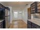 Cozy dining area with tile flooring, a stylish light fixture, and a window for natural light at 600 Northern Way # 404, Winter Springs, FL 32708