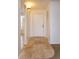 Entryway with travertine tile flooring leading to carpeted area, and coat closet at 600 Northern Way # 404, Winter Springs, FL 32708