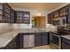 Updated kitchen featuring stone counters, stainless steel appliances and stylish cabinetry at 600 Northern Way # 404, Winter Springs, FL 32708