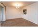 Bright living room features a sliding glass door to a private balcony and a pass-through to the kitchen at 600 Northern Way # 404, Winter Springs, FL 32708