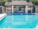 Community swimming pool and cabana area with seating and lounging at 600 Northern Way # 404, Winter Springs, FL 32708