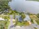 Stunning aerial view showcasing a waterfront home, private dock, and scenic views of the river at 716 Palm Circle Dr, Port Orange, FL 32127