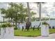Well-maintained backyard with ample seating, lush lawn, and direct access to waterfront at 716 Palm Circle Dr, Port Orange, FL 32127