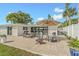 Relaxing outdoor area featuring a dining table, fire pit, and picturesque water view at 716 Palm Circle Dr, Port Orange, FL 32127