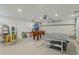 Finished basement featuring recreational games and abundant space for entertainment at 716 Palm Circle Dr, Port Orange, FL 32127