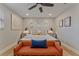 Calm bedroom featuring a bed with pillows, a seating bench, and stylish bedside tables at 716 Palm Circle Dr, Port Orange, FL 32127