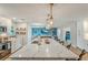 Open concept kitchen with island and view into the living area of the home at 716 Palm Circle Dr, Port Orange, FL 32127