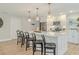 Modern kitchen with a large island, pendant lighting, and stainless steel appliances at 716 Palm Circle Dr, Port Orange, FL 32127