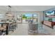 Bright living room with tile flooring, view of the water, and walk out to the patio at 716 Palm Circle Dr, Port Orange, FL 32127