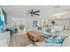 Open-concept living room with view to kitchen and dining area, and coastal decor at 716 Palm Circle Dr, Port Orange, FL 32127