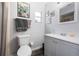 Cozy bathroom with updated gray vanity, drawers, and framed mirror at 741 Maderia Ct, Kissimmee, FL 34758