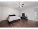 Bedroom features ceiling fan, a hardwood floor, and neutral walls at 741 Maderia Ct, Kissimmee, FL 34758
