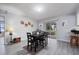Cozy dining area with sliding glass doors, view to backyard, and access to the kitchen at 741 Maderia Ct, Kissimmee, FL 34758