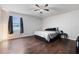 Inviting bedroom with wood-look floors, a comfortable bed, and a relaxing atmosphere at 741 Maderia Ct, Kissimmee, FL 34758