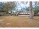 Large backyard with mature trees, offering a serene and private outdoor space at 7730 Pineapple Dr, Orlando, FL 32835