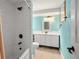 Bathroom with a tub and shower, white subway tile, and a toilet near a bright vanity and mirror at 7730 Pineapple Dr, Orlando, FL 32835