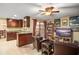 Open floor plan with a combined kitchen and living room with lots of light and comfortable seating at 7730 Pineapple Dr, Orlando, FL 32835