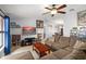 Spacious living room featuring a ceiling fan, and an entertainment center at 7730 Pineapple Dr, Orlando, FL 32835