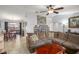 Bright living room showcases an open layout, tile flooring, and direct access to the dining area at 7730 Pineapple Dr, Orlando, FL 32835
