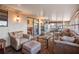 Relaxing sunroom featuring a comfortable seating area, large windows, and natural light at 7730 Pineapple Dr, Orlando, FL 32835