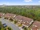 Beautiful townhomes with tile roofs, garages and manicured lawns are set amidst a picturesque landscape at 8201 Roseville Rd, Davenport, FL 33896