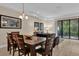 Inviting dining area with sliding glass doors, seamlessly connecting indoor and outdoor living spaces at 8201 Roseville Rd, Davenport, FL 33896