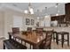 Bright dining area showcases stylish pendant lighting and easy access to the kitchen and bar at 8201 Roseville Rd, Davenport, FL 33896