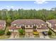 Charming townhomes with brick driveways, garages, and beautiful landscaping near a lush forest at 8201 Roseville Rd, Davenport, FL 33896