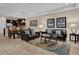 Open-concept living area features modern furnishings, neutral tones, and a seamless flow to the dining area at 8201 Roseville Rd, Davenport, FL 33896