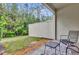 Cozy covered patio with brick pavers and a view of the lush backyard at 8201 Roseville Rd, Davenport, FL 33896