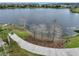 Scenic lake view with a paved walking trail in a peaceful, suburban community at 8517 Karrer Ter, Orlando, FL 32827