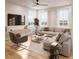 Bright living room with large windows, modern furniture, and hardwood floors at 8517 Karrer Ter, Orlando, FL 32827