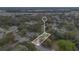 Aerial view of a lot surrounded by mature trees and a paved road at 1014 24Th St, Orlando, FL 32805