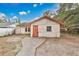 Exterior view of a small home featuring a quaint design and compact yard space at 1014 24Th St, Orlando, FL 32805