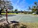 Outdoor basketball court in community with two hoops for friendly games, and hopscotch adding a playful touch at 12137 Dickenson Ln, Orlando, FL 32821