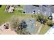 Aerial view of basketball court, garden, and playground in a sunny community setting at 12137 Dickenson Ln, Orlando, FL 32821