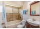 Well-lit bathroom features a shower-tub combo, with a vanity offering storage at 12137 Dickenson Ln, Orlando, FL 32821