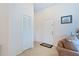 Bright foyer featuring neutral tile, a storage closet, and a white front door at 12137 Dickenson Ln, Orlando, FL 32821