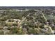 Discover a peaceful neighborhood with mature trees and well-maintained homes from this expansive aerial perspective at 1525 Orange Tree Dr, Edgewater, FL 32132