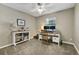 Bedroom with neutral walls, carpet flooring, a ceiling fan, and a desk area at 1525 Orange Tree Dr, Edgewater, FL 32132