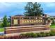 Welcoming entrance sign for Hawkshoor, set against a backdrop of lush landscaping at 16410 Taliesin St, Winter Garden, FL 34787