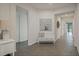 Hallway with tile flooring, neutral paint, and decorative art, creating a seamless transition between rooms at 16410 Taliesin St, Winter Garden, FL 34787