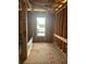 Unfinished bathroom with a window view, framing, and plumbing at 166 Hammock Preserve Loop, Winter Garden, FL 34787